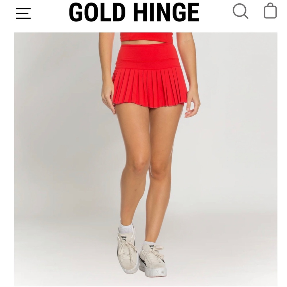 Pair of two gold hinge tennis skirts